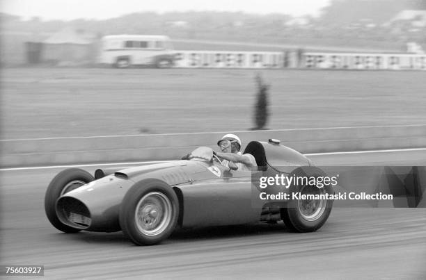 Italian Ferrari driver Eugenio Castellotti during the British Grand Prix at Silverstone, 14th July 1956. Castellotti started out in car number 3 but...