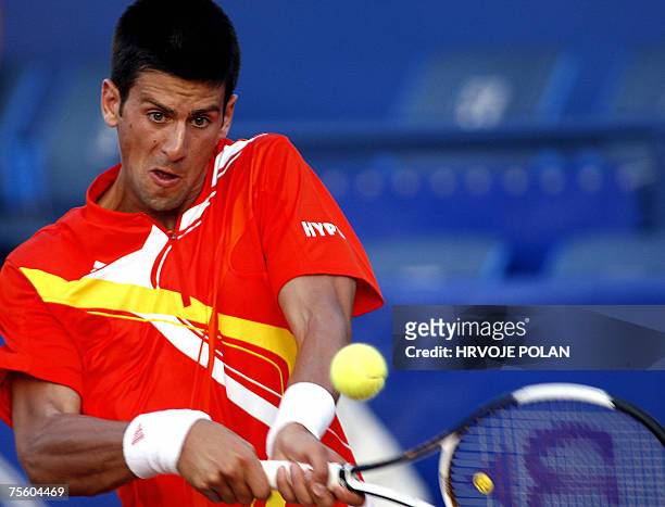 Novak Djokovic from Serbia returns a backhand to Pablo Andujar from Spain during their 1st round match of Croatia Open ATP tennis tournament in Umag,...