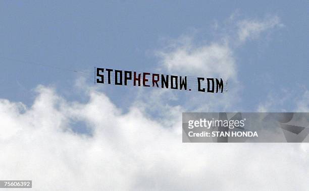 Charleston, UNITED STATES: A small plane tows a sign advertising an anti-Senator Hillary Rodham Clinton web site as preparations are made for the...