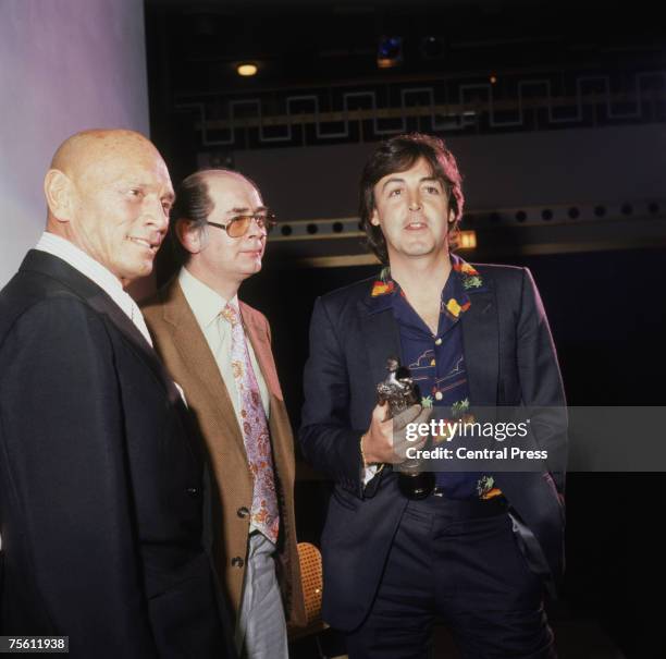 Former Beatle Paul McCartney with Russian-born actor Yul Brynner after he was presented with an Ivor Novello Award at the Grosvenor House Hotel,...