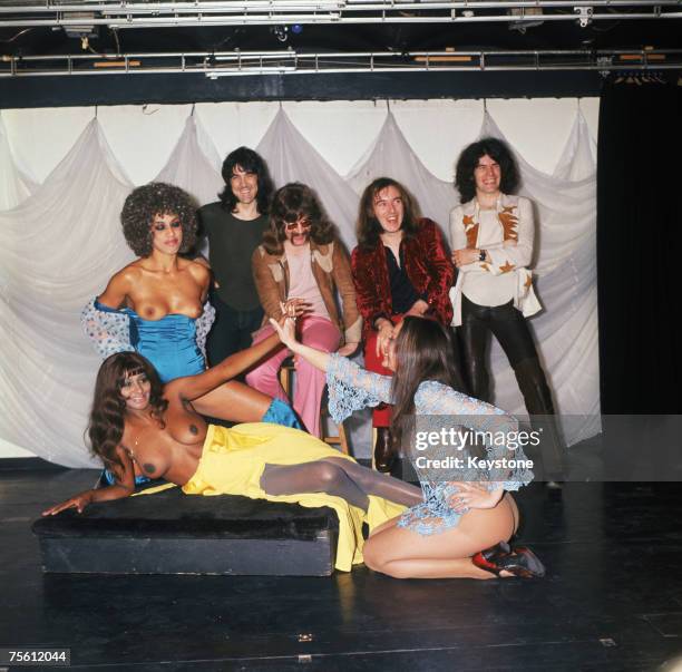 Scottish rock group Nazareth with a trio of scantily-clad ladies, 27th October 1971. Left to right: Manny Charlton, Darrell Sweet , Pete Agnew and...