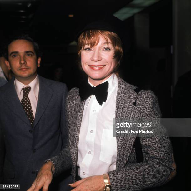 American actress and dancer Shirley Maclaine in a herringbone jacket and bow tie, circa 1980.