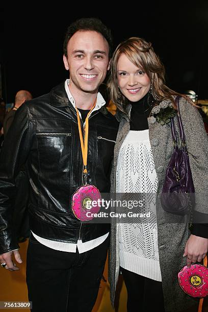 Nathan Foley from Hi Five and Melissa Stone arrives on the yellow carpet at "The Simpsons Movie" Australian premiere at Hoyts Entertainment Quarter,...