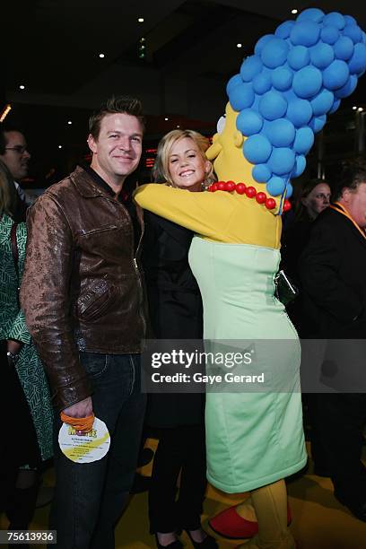 Actor Matt Passman and Actress Rachel Carpani arrive on the yellow carpet at "The Simpsons Movie" Australian premiere at Hoyts Entertainment Quarter,...