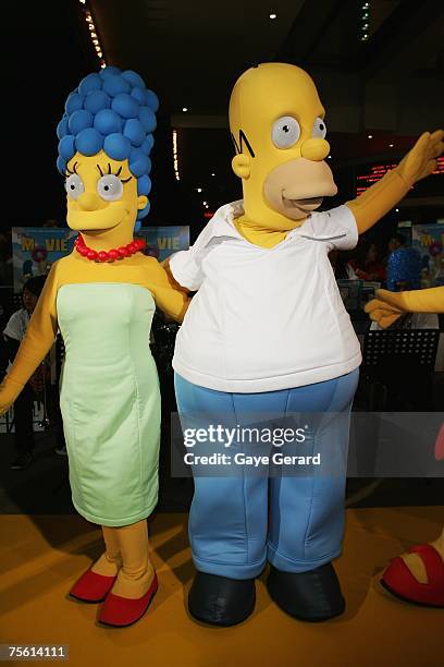 Marg and Homer Simpson pose on the yellow carpet at "The Simpsons Movie" Australian premiere at Hoyts Entertainment Quarter, Moore Park on July 24,...