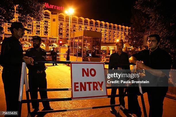 Pakistani security on guard outside the Marriott hotel July 24, 2007 in Islamabad, Pakistan. While the capitol city remains quiet, security has been...
