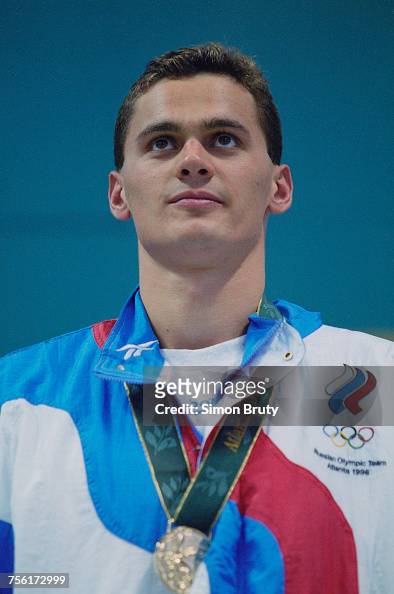 Alexander Popov of Russia celebrates with his gold medal after... News ...