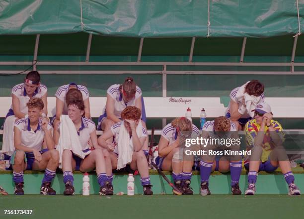 Jane Sixsmith, Mandy Davies, Rhona Simpson and members of the Great Britain Women's field hockey team show their emotion and disappointment after...