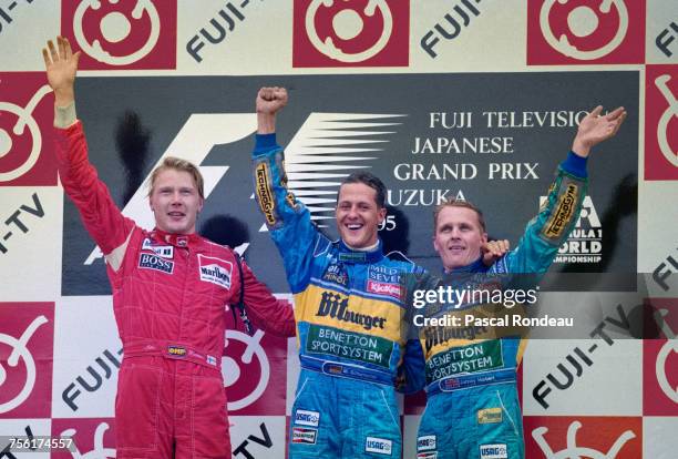 Michael Schumacher of Germany and driver of the Mild Seven Benetton Renault Benetton B195Renault RS7 V10 celebrates with third placed team mate...