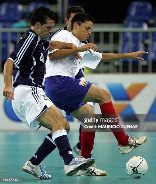 Rio de Janeiro, BRAZIL: Costa Ricas's Daniel Colindres battles for the ball with Argentina's Diego Giustozzi during the first round of futsal...