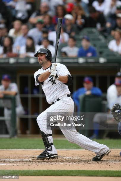 Paul Konerko of the Chicago White Sox hits a solo home run during the game against the Chicago Cubs at U.S. Cellular Field in Chicago, Illinois on...