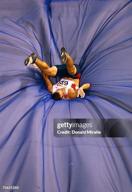 Ryan Harlan of the United States of America lands after a successful attempt in the Pole Vault portion of the Men's Decathlon during the 2007 XV Pan...