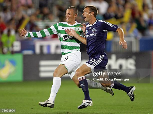 Jimmy Conrad of the MLS All-Stars and Kenny Miller of Glasgow Celtic FC vie for position during the 2007 Sierra Mist MLS All-Star Game at Dick's...