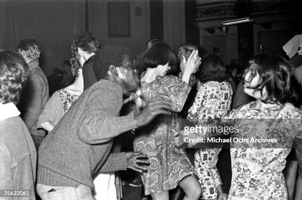 Hippies dance at a psychedelic rock concert at the Fillmore Auditorium in San Francisco, California, in early summer, 1967.