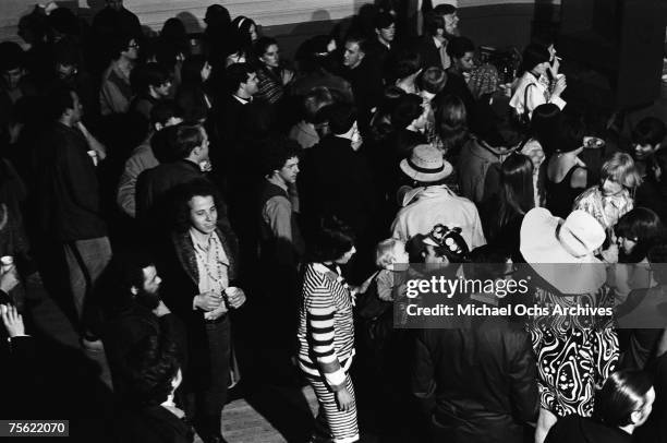 Hippies wait for the concert to start at the Fillmore Auditorium in San Francisco, California, in early summer, 1967.