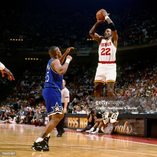 Clyde Drexler of the Houston Rockets attempts a shot against Nick Anderson of the Orlando Magic in Game Four of the 1995 NBA Finals played June 14,...