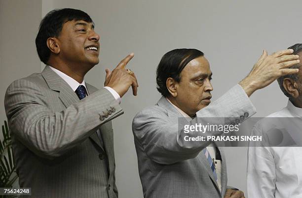 Mittal Investments Chairman Lakshmi N Mittal and Indian Minister for Petroleum and Natural Gas Murali Deora gesture during a meeting in New Delhi, 25...