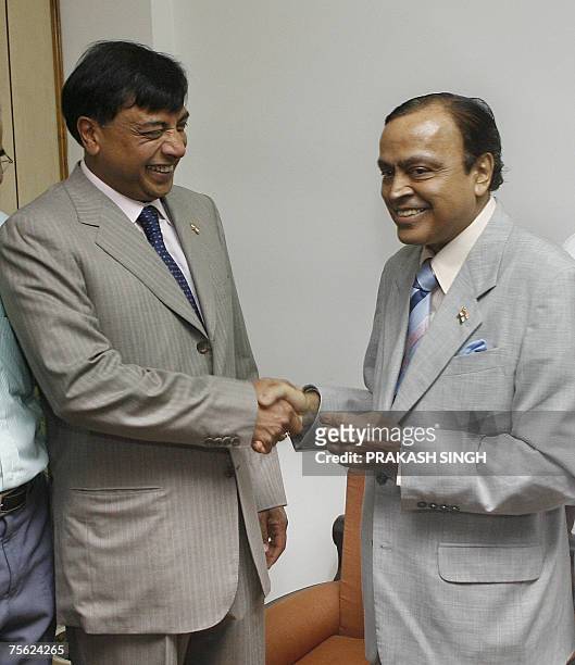 Mittal Investments Chairman Lakshmi N Mittal shakes hands with Indian Minister of Petroleum and Natural Gas Murali Deora during a meeting in New...