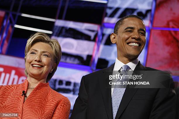 Democratic presidential candidates, New York Senator Hillary Clinton and Illinois Senator Barack Obama stand on stage prior to the start of the...