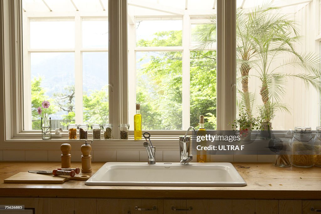 Cooking tools beside sink in kitchen