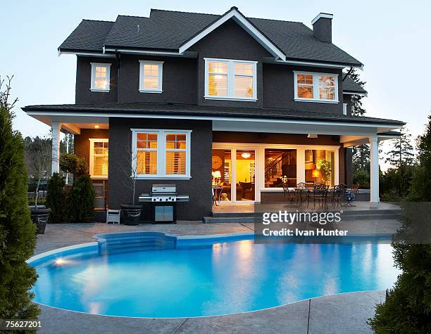 canada, british columbia, surrey, back yard of house with pool at dusk - terrace british columbia stock pictures, royalty-free photos & images