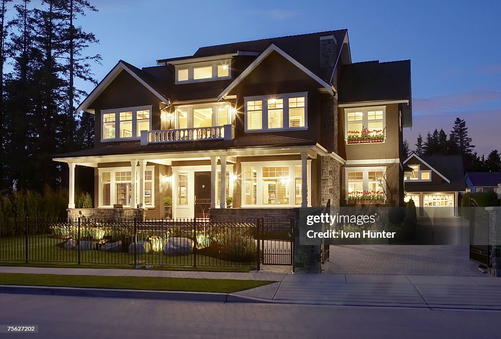 Canada, British Columbia, Surrey, front exterior of house illuminated at dusk (long exposure)