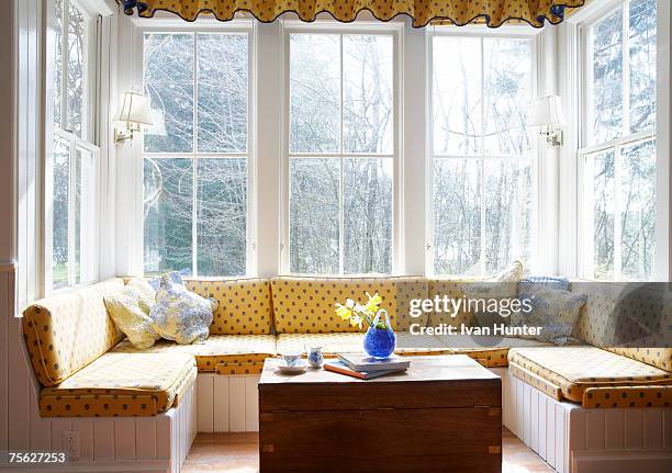 window seat with table - bay window interior stock pictures, royalty-free photos & images