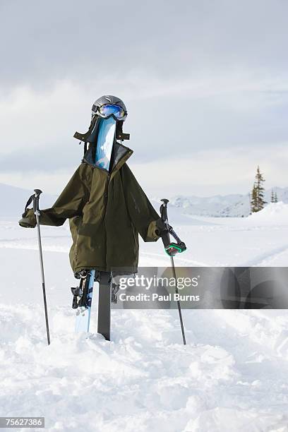 scarecrow in winter landscape made of skis, poles and ski-wear - scarecrow faces stock pictures, royalty-free photos & images