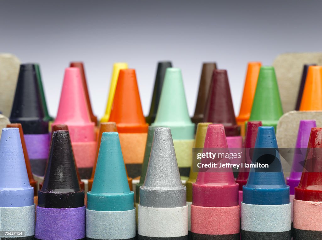 Rows of colourful crayons, close-up