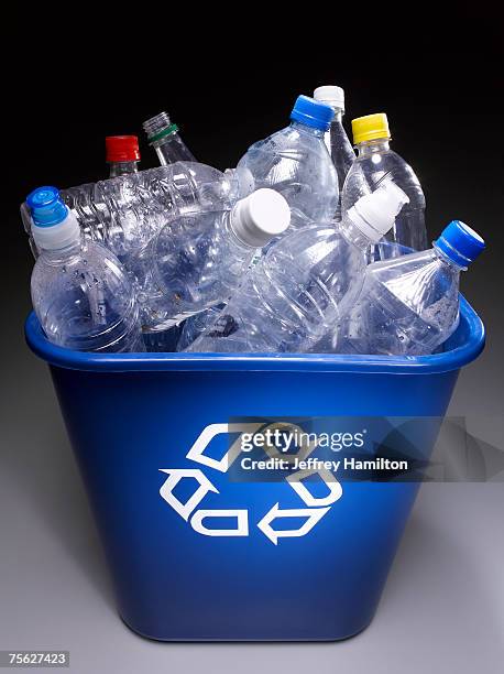 plastic bottles in trash bin with recycle sign, elevated view - full responsibility stock pictures, royalty-free photos & images