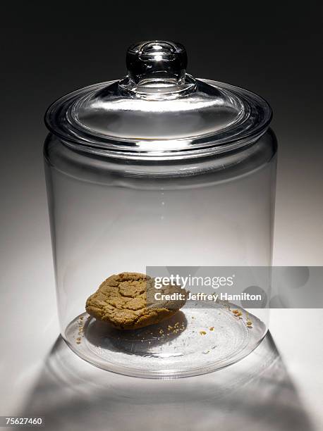 single cookie in cookie jar - cookie jar stock pictures, royalty-free photos & images