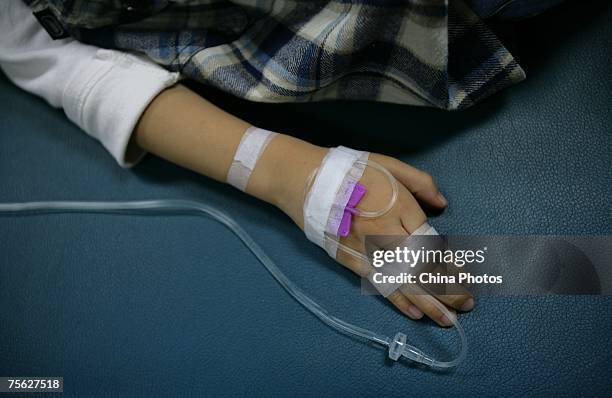 Young patient receives treatment at Chongqing Children's Hospital on July 25, 2007 in Chongqing Municipality, China. China plans to set up a...