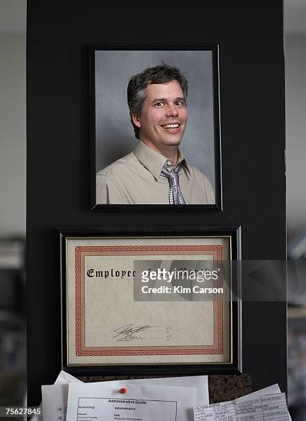 employee of the month certificate with photo of man - employee of the month stock pictures, royalty-free photos & images