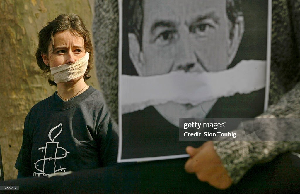Tracy Housel A protester wears a gag March 7, 2002 in London to illustrate the ...