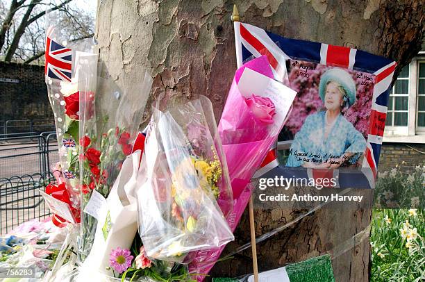 Floral tributes are placed outside St. James Palace April 3, 2002 in London following the death of the Queen Mother on saturday March 31, 2002....