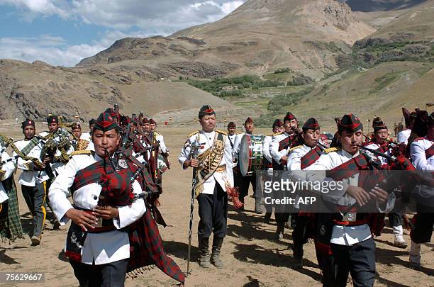 Indian army band members perform during "Vijay Diwas" or Victory Day celebrations in Drass, some 160 kms east of Srinagar, 25 July 2007. The Indian...
