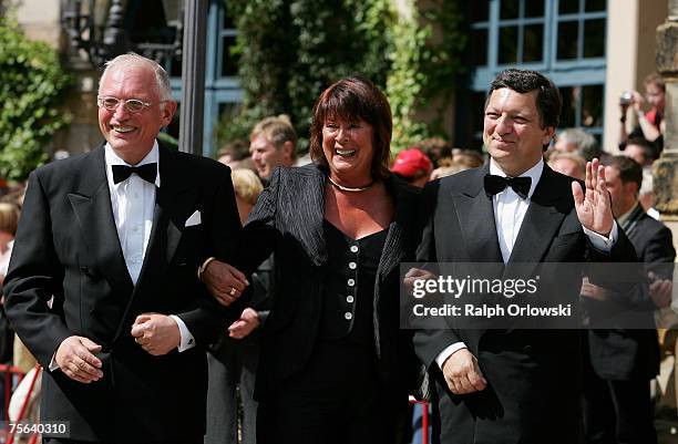 President of the European Commission Jose Manuel Barroso and his deputy Guenter Verheugen accompanied by his wife Gabriele arrive for the premiere of...