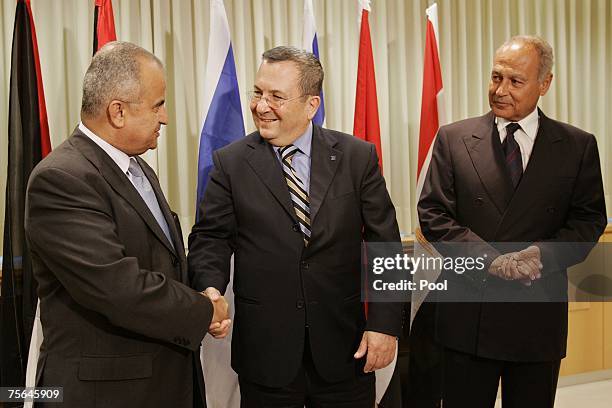 Israeli Defense Minister Ehud Barak shakes hands with Jordanian Foreign Minister Abdul-Ilah Khatib as Egyptian Foreign Minister Ahmed Aboul Gheit...