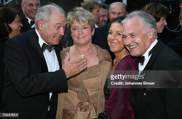 Guenther Beckstein, his wife Marga, Helena Huber and her husband Erwin Huber chat together during the first pause of the premiere of the Richard...