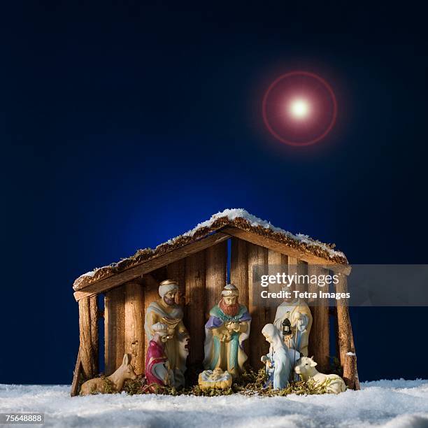 creche under star in sky - manger stock pictures, royalty-free photos & images