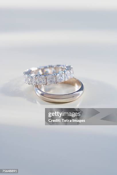 close up of engagement and wedding rings - platinum rings stock pictures, royalty-free photos & images