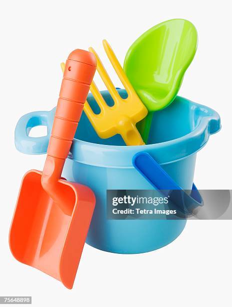 close up of toy pail and shovels - balde imagens e fotografias de stock