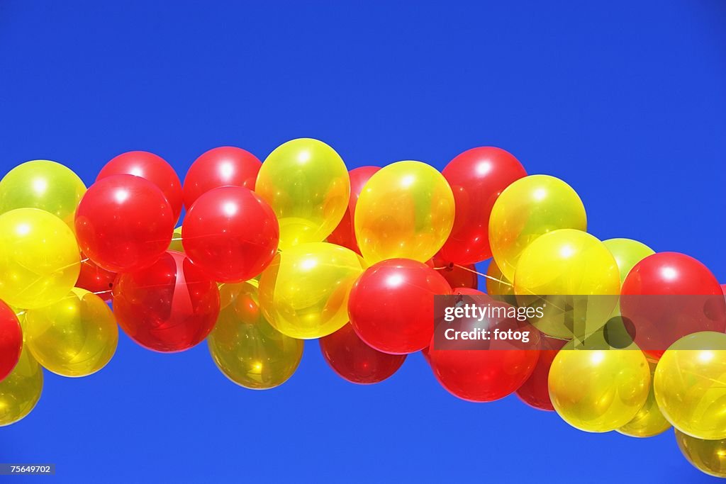 Balloon arch under blue sky