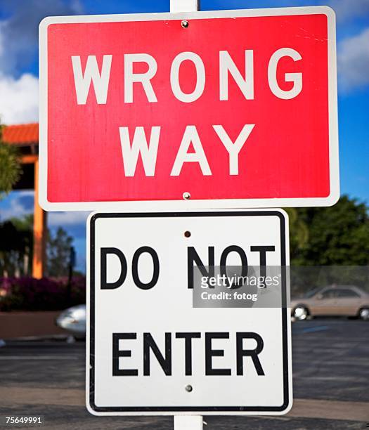 wrong way and do not enter signs - wrong way stockfoto's en -beelden