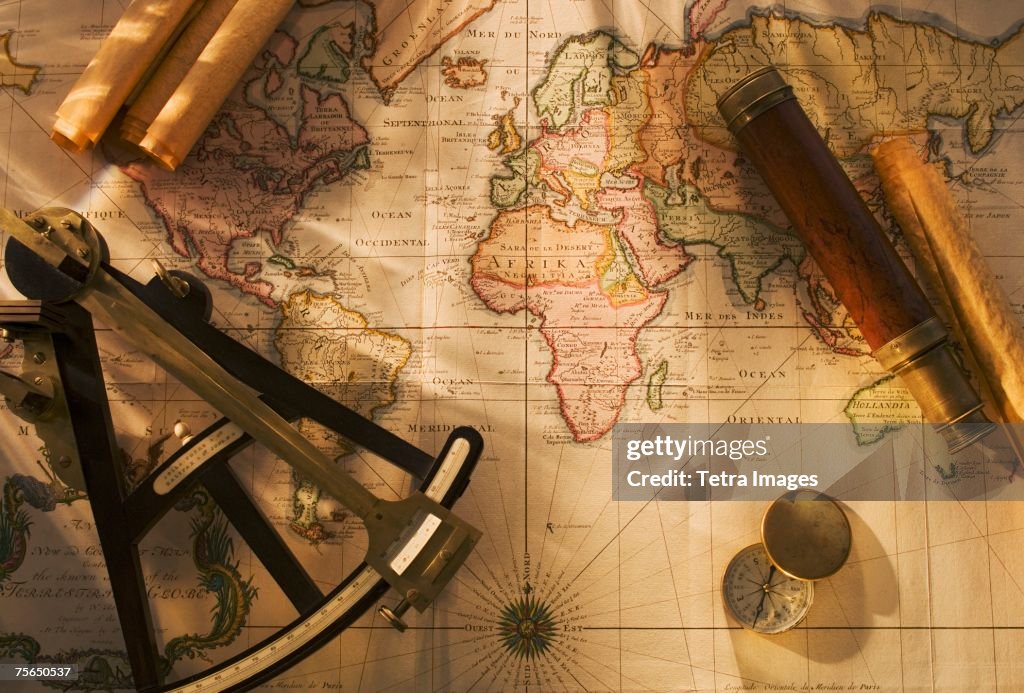 Octant Compass And Telescope On Nautical Map Photo - Getty Images