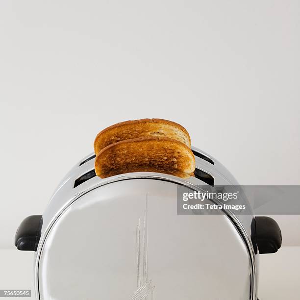 close up of toast in toaster - toaster stock pictures, royalty-free photos & images