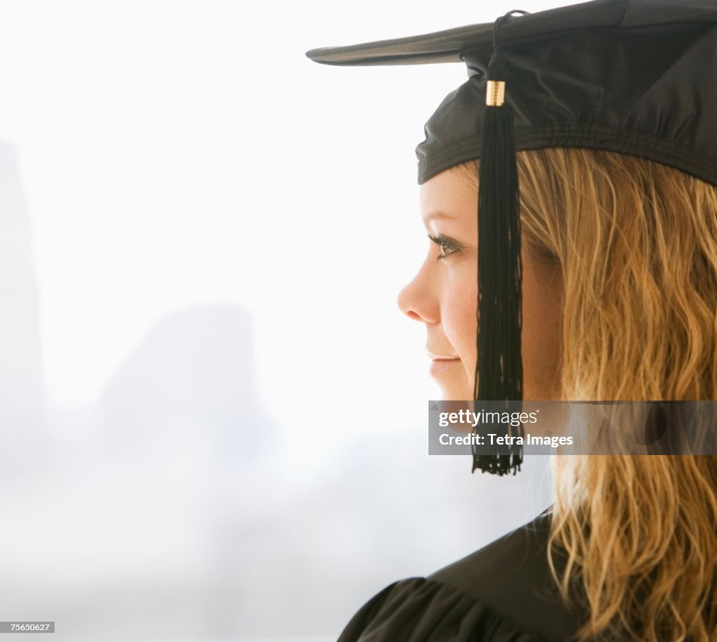 Woman wearing graduation cap and gown