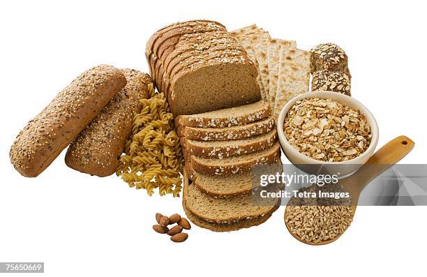 close up of assorted grains and bread - integrale foto e immagini stock