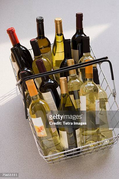 shopping basket filled with wine - wine basket stock pictures, royalty-free photos & images