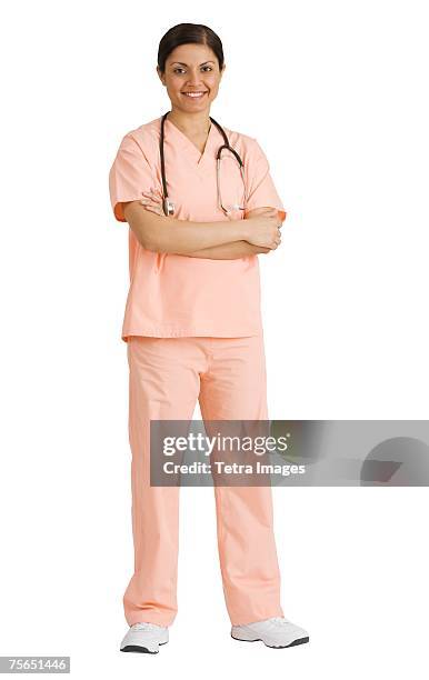 indian female doctor with arms crossed - nurse standing stock pictures, royalty-free photos & images